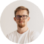 inside portrait of confident young man in white cl 3PVKGN2.png